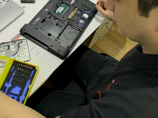 Electronics technician working on device repair